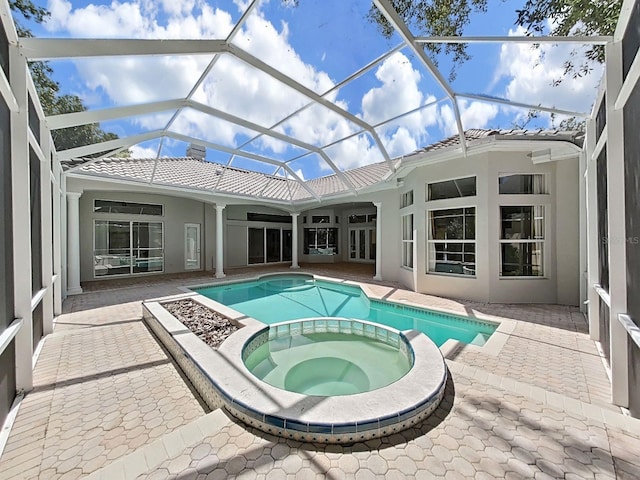 10106 Radcliffe Dr, Tampa, FL 33626 - view of pool with a pool with connected hot tub, a patio, and a lanai
