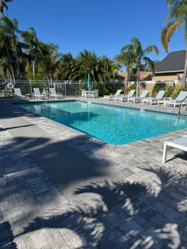 view of swimming pool with a patio area