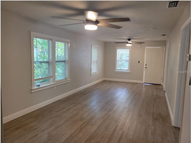 spare room featuring hardwood / wood-style flooring and ceiling fan