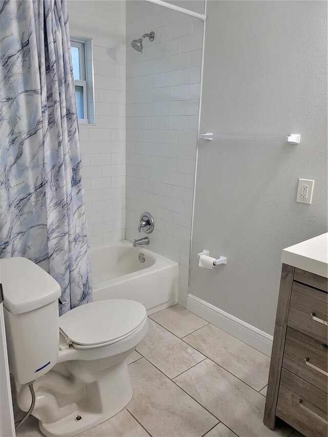 full bathroom featuring tile patterned floors, vanity, shower / bathtub combination with curtain, and toilet