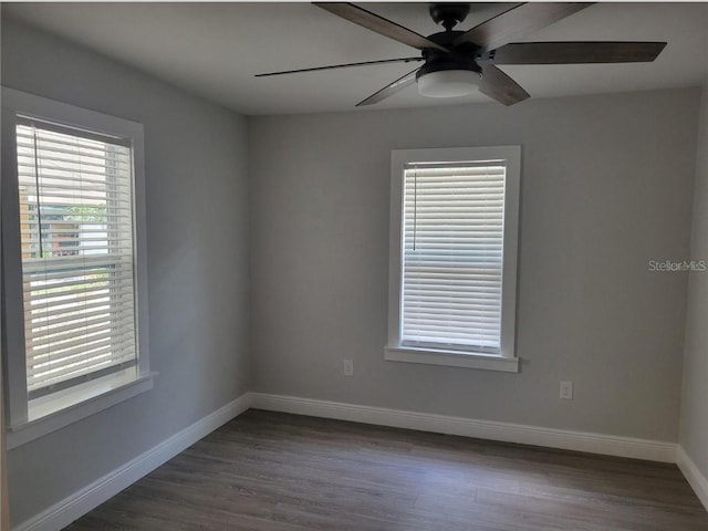 spare room featuring dark wood-type flooring