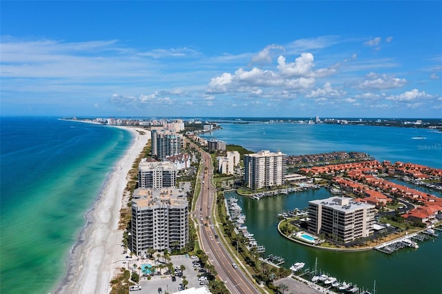 birds eye view of property with a view of the beach and a water view