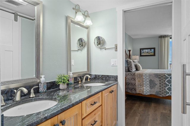 bathroom featuring vanity and wood-type flooring