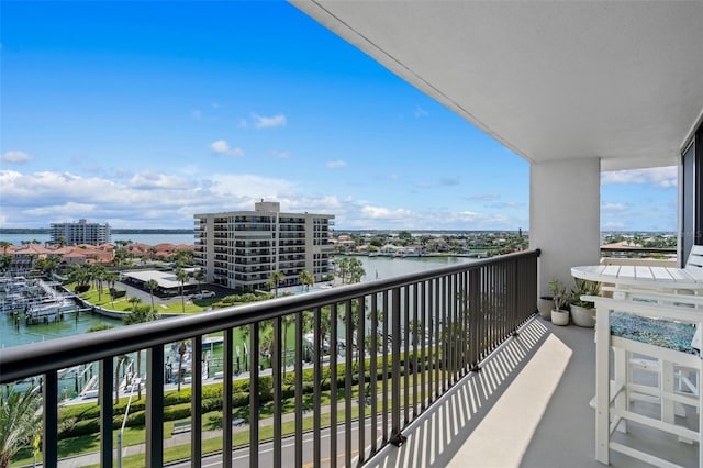 balcony featuring a water view