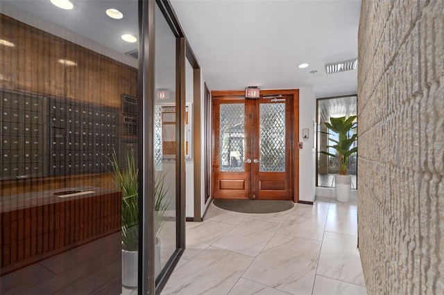 entryway with mail boxes and french doors