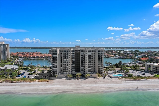 birds eye view of property featuring a water view and a view of the beach