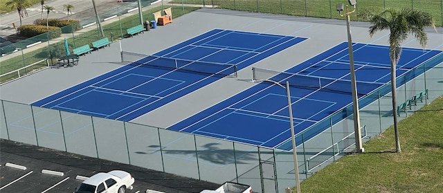 view of tennis court featuring basketball hoop