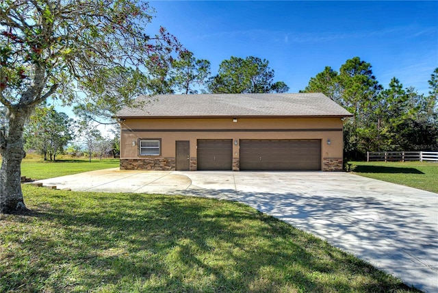 garage featuring a lawn