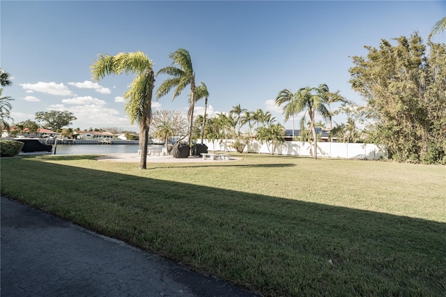 view of yard with a patio area and a water view