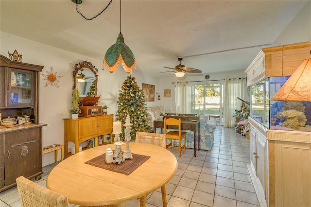 tiled dining area featuring ceiling fan