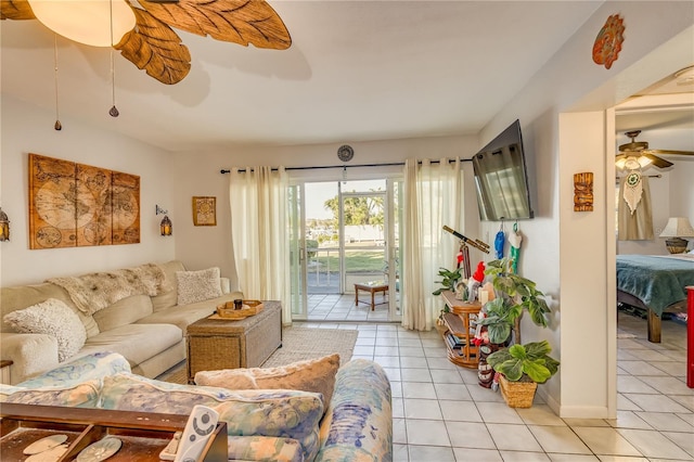 tiled living room with ceiling fan