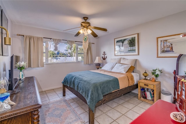 bedroom with light tile patterned floors and ceiling fan