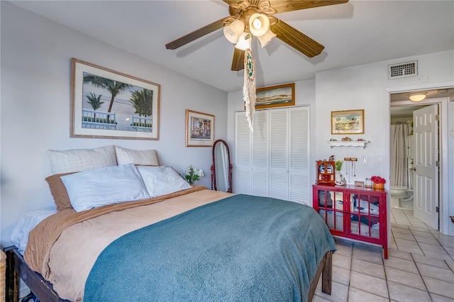 bedroom with light tile patterned floors, a closet, and ceiling fan