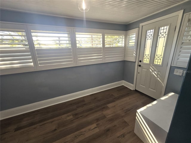 interior space with a healthy amount of sunlight, dark wood finished floors, and baseboards