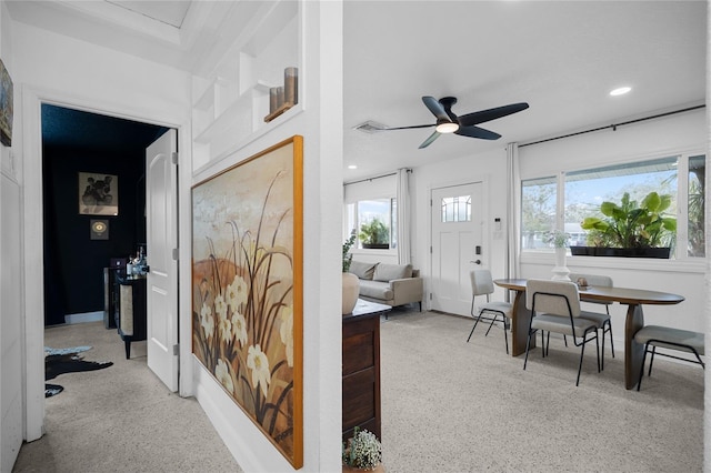 interior space featuring ceiling fan