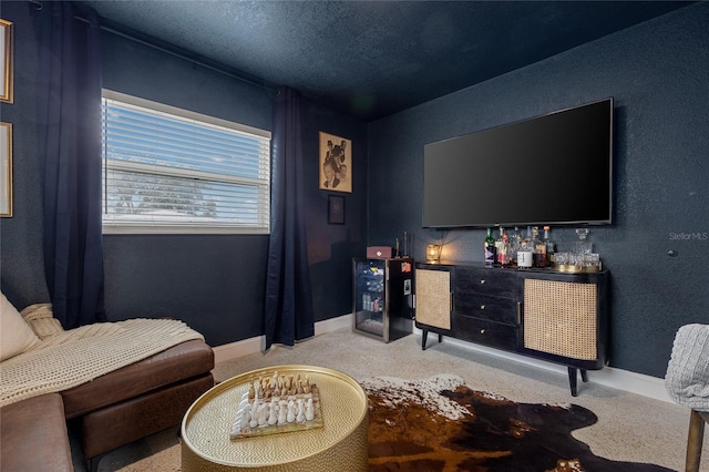 living area featuring bar and a textured ceiling