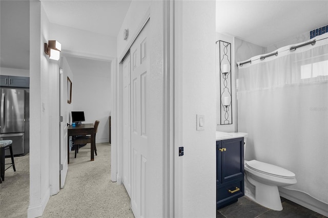 bathroom featuring vanity and toilet