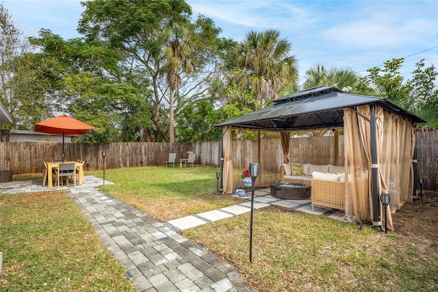 view of yard with a gazebo, a patio area, and an outdoor hangout area