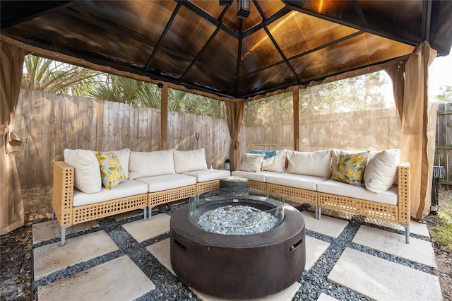 view of patio / terrace with a gazebo and an outdoor living space with a fire pit