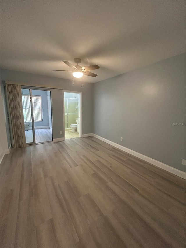 spare room featuring ceiling fan and hardwood / wood-style flooring