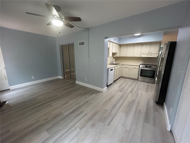 kitchen with light hardwood / wood-style flooring, ceiling fan, appliances with stainless steel finishes, ventilation hood, and white cabinets