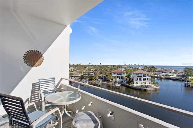 balcony featuring a water view