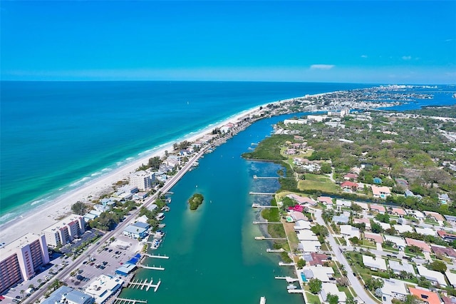 drone / aerial view featuring a water view and a beach view