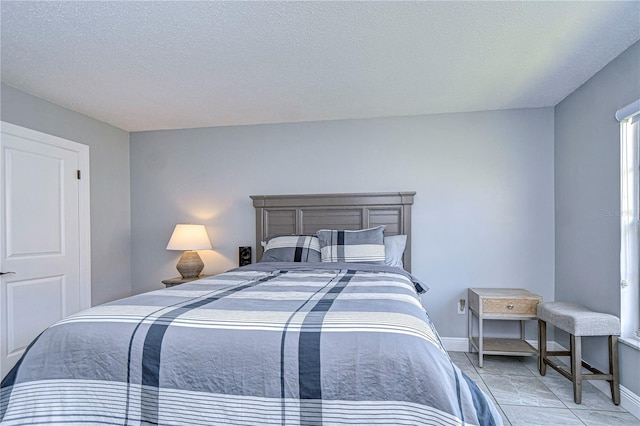 bedroom featuring a textured ceiling