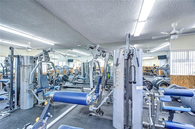 workout area featuring ceiling fan and a textured ceiling