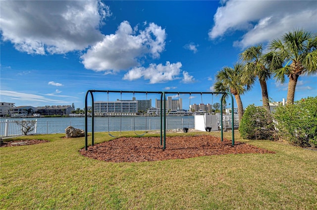 exterior space featuring a yard and a water view