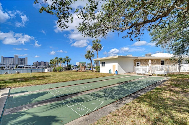 view of property's community featuring a yard