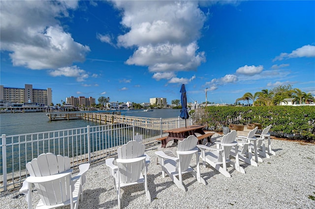 view of patio / terrace featuring a boat dock and a water view