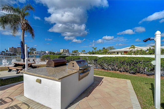 view of patio featuring an outdoor kitchen and grilling area