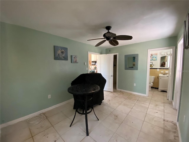 sitting room featuring ceiling fan