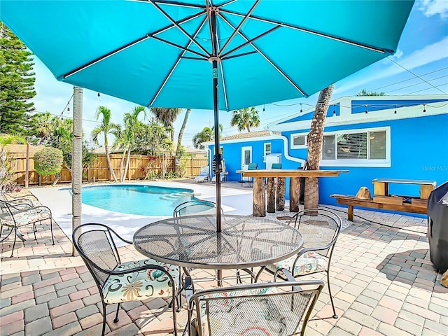 view of swimming pool with a patio area