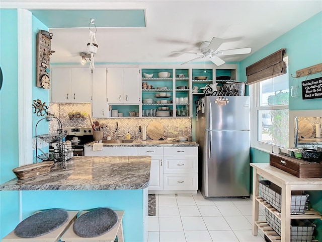 kitchen featuring white cabinetry, sink, ceiling fan, tasteful backsplash, and appliances with stainless steel finishes