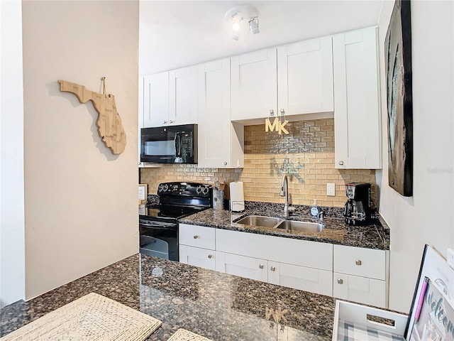 kitchen featuring white cabinetry, sink, dark stone countertops, decorative backsplash, and black appliances