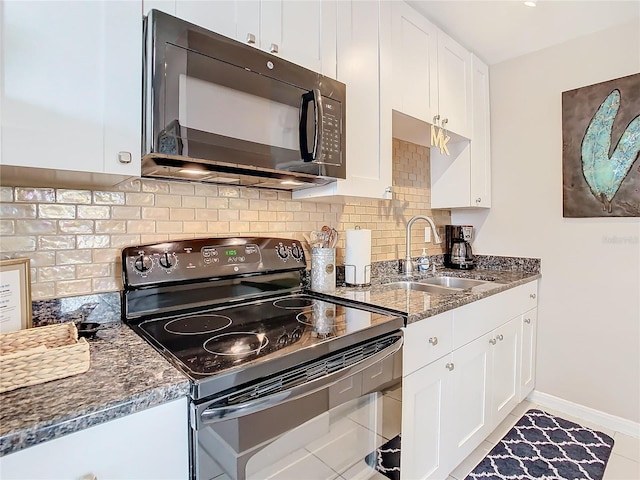 kitchen with white cabinets, sink, backsplash, and black appliances