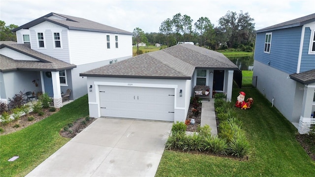 front of property featuring a garage and a front yard