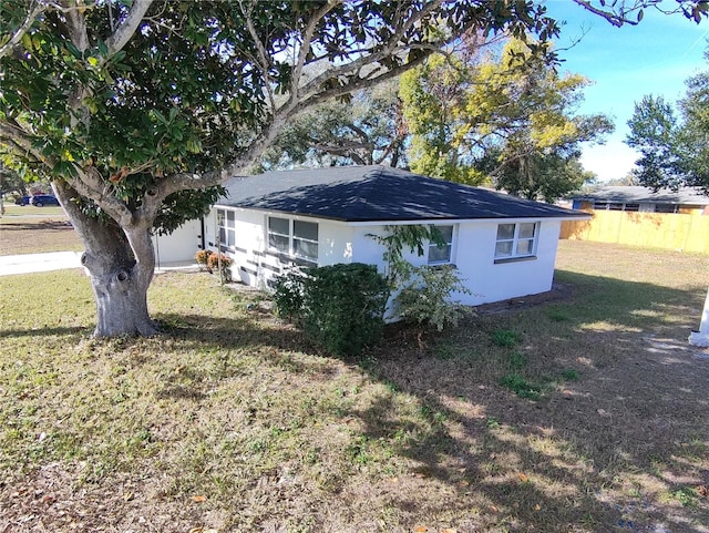 view of home's exterior featuring a lawn