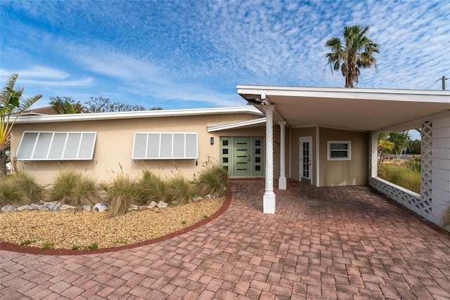 view of front of home with a carport