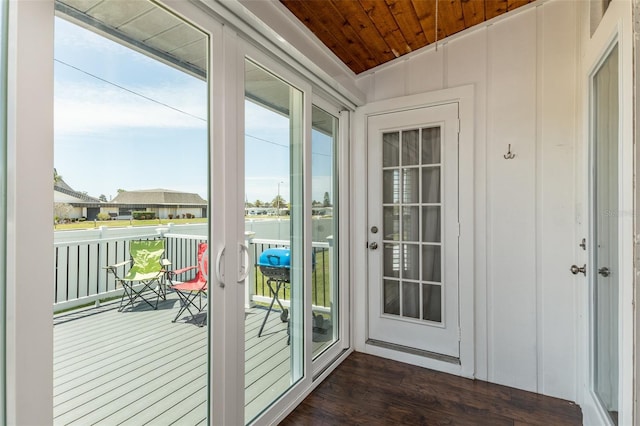 doorway to outside with wooden ceiling, dark wood-type flooring, and french doors