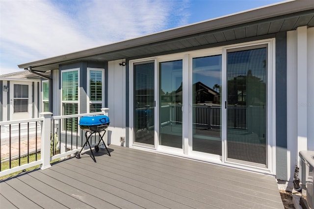 wooden deck with area for grilling