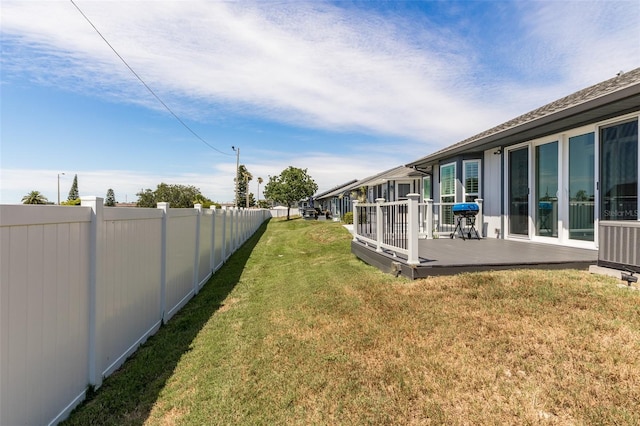 view of yard featuring a wooden deck