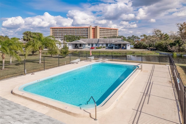 view of swimming pool featuring a patio area