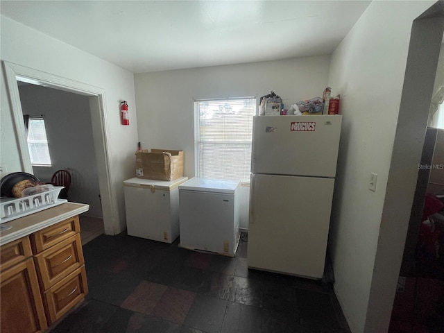 laundry area featuring washing machine and clothes dryer