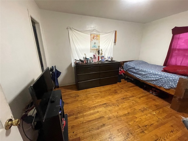 bedroom featuring hardwood / wood-style floors