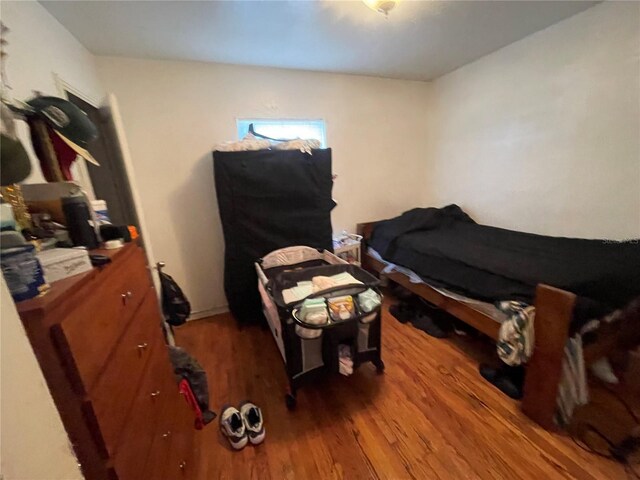 bedroom with wood-type flooring