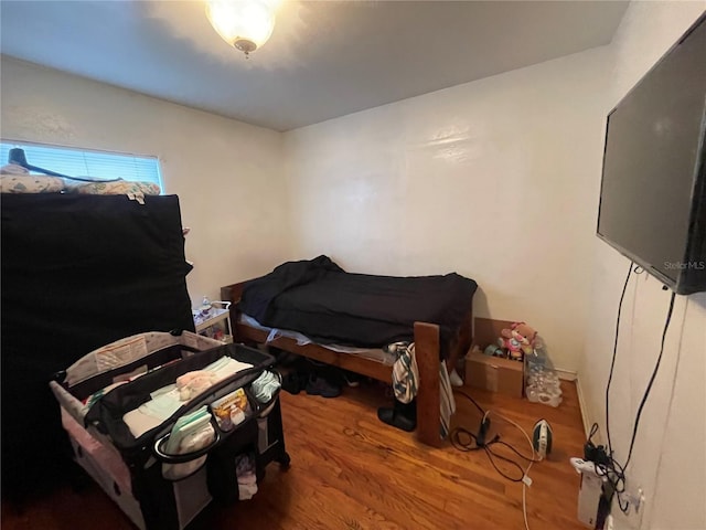 bedroom featuring hardwood / wood-style flooring