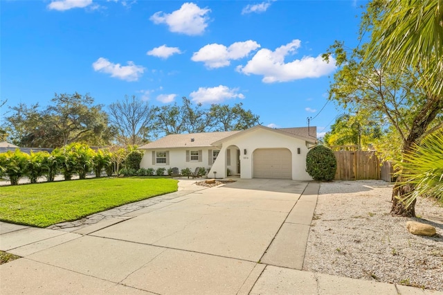 ranch-style house featuring a garage and a front lawn